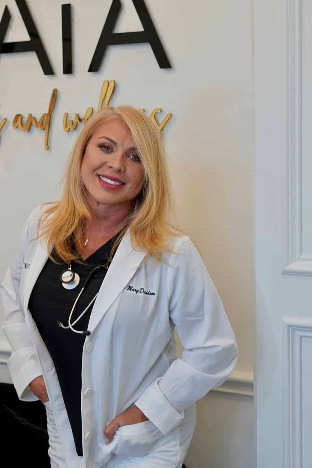 Smiling healthcare professional in a clinic setting.