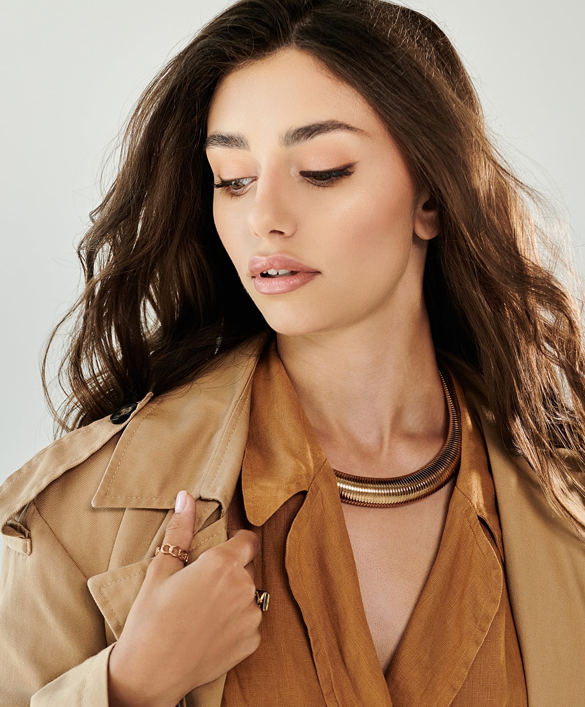 Katy Botox woman in fashion outfit with jewelry accessories.